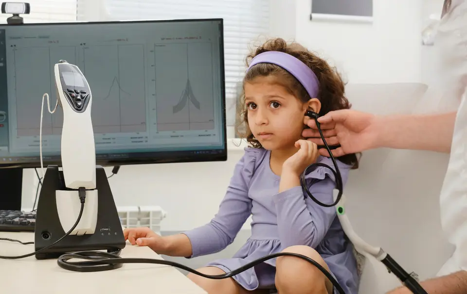 Child taking a hearing test